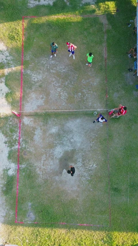 Aerial view of group of young men are playing takraw in the afternoon Stock Footage 297621546