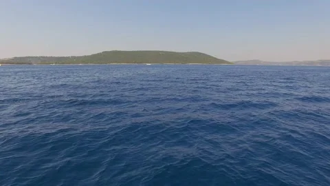Aerial view of groups of dolphins jumping at Adriatic sea, Croatia. Stock Footage 148998657