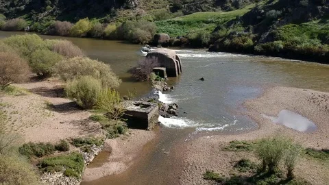 Aerial view Guadiana river with the old traditional watermills Stock Footage 88409302