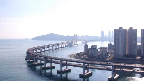 Aerial view of Gwangandaegyo bridge and Cityscape in Busan, South Korea Stock Footage