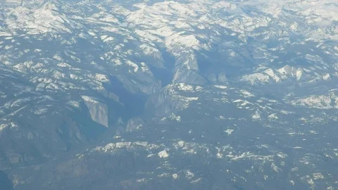 Aerial view of half dome and heavily snow covered sierra nevada mountains Stock Footage 75851484