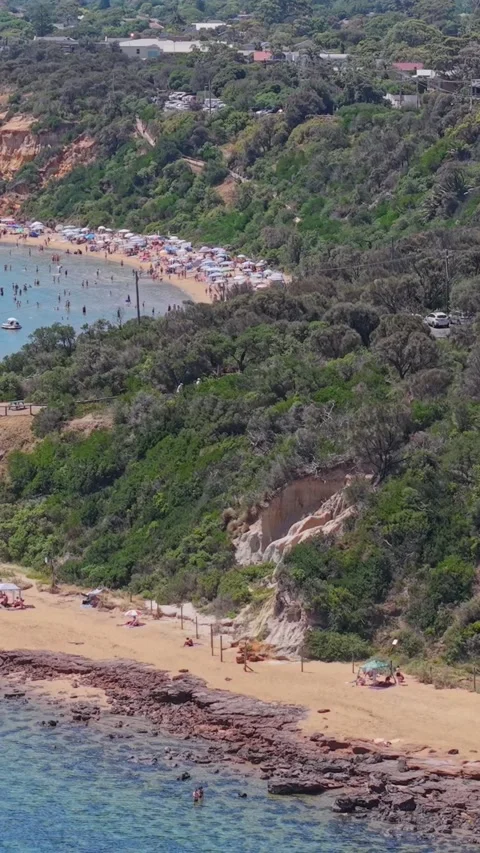 Aerial View of Half Moon Bay Beach and Red Bluff Cliffs in Black Rock Stock-Footage 327911511