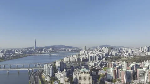 Aerial view of Han River and Jamsil skyline seen from Gwangjin-gu, Seoul Stock Footage 332405264
