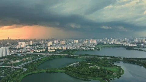 Aerial view of Hanoi Ring Road 3 through Yen So amid lakes and storm clouds Stock Footage 344742943