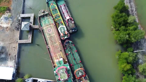 Aerial view of the harbor area of fuel tankers on a river close to the sea Stock Footage 246745136