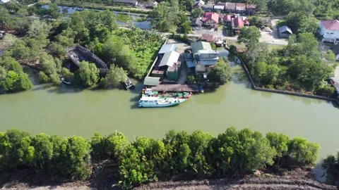 Aerial view of the harbor area of fuel tankers on a river close to the sea Stock Footage 246745933