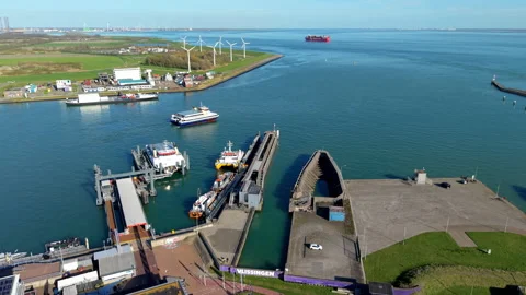 Aerial view of a harbor with ferries, docks, service vessels, parking Stock Footage 336744173