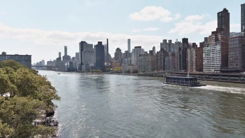 Aerial View of Harlem River with Ferry and Manhattan Skyline Stock Footage 283927433