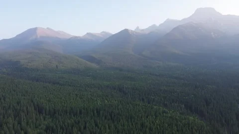 Aerial View of a Hazy Mountain Range at Sunrise Stock Footage 318818043