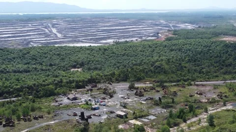 Aerial view of heavy coal mining equipment parked in the workshop Stock Footage 329401321