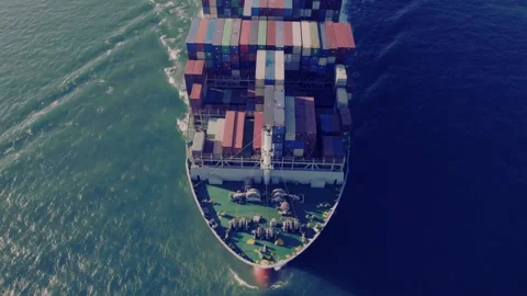 Aerial view of heavy container ship cruising in the deep blue ocean Stock Footage 332870001