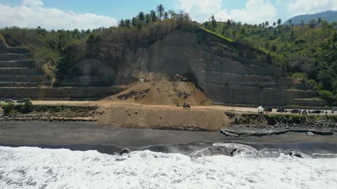 Aerial view of heavy excavators clearing a massive landslide Stock Footage 345197363