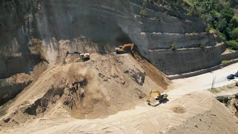 Aerial view of heavy excavators clearing a massive landslide Stock Footage 345197734