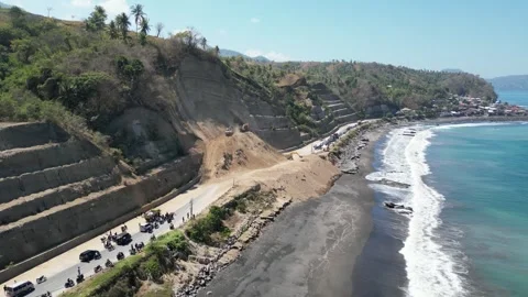 Aerial view of heavy excavators clearing a massive landslide Stock Footage 345197923