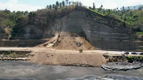 Aerial view of heavy excavators clearing a massive landslide Stock Footage 345197967