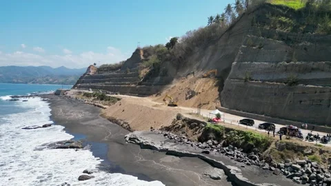 Aerial view of heavy excavators clearing a massive landslide Stock Footage 345198329