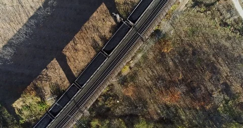 Aerial View of Heavy Loaded Cargo Train Runs on Railway Bridge Stock Footage 119489879