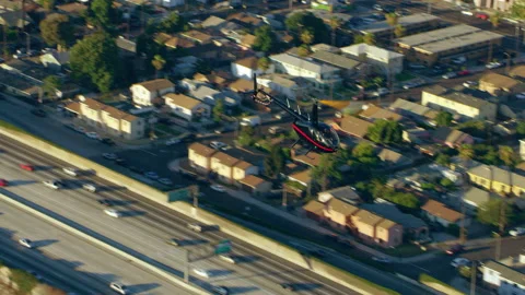 Aerial view of helicopter flying over city highway during the day in Los Angeles Stock-Footage 199453071