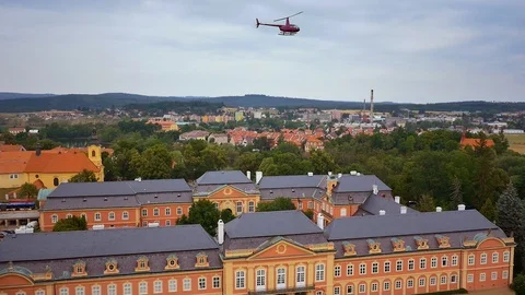 Aerial view of helicopter taking off and fly away from the Castle in Prague Stock Footage 103220732