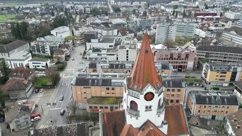 Aerial view of hexagonal tower of the local Protestant church. Stock Footage 343552486