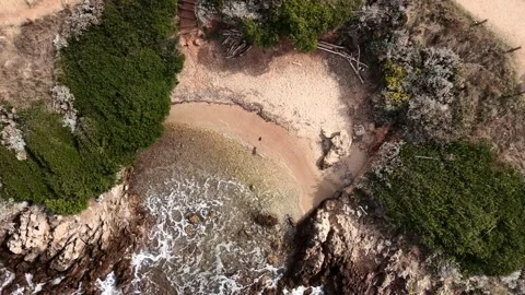 Aerial view of a hidden beach in a small bay at Cap d'Antibes Stock Footage 321755894