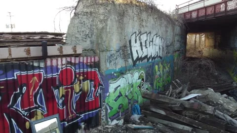 Aerial View of hidden Graffiti under train tunnel in Chicago Stock Footage 250021772