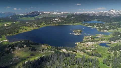 Aerial view of a high alpine mountain lake in the Beartooth Mountains Stock Footage 267128602