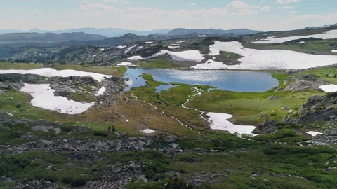 Aerial view of a high alpine mountain lake in the Beartooth Mountains Stock Footage 267129250