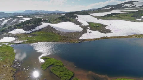 Aerial view of a high alpine mountain lake in the Beartooth Mountains Stock Footage 267129409