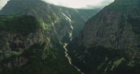 Aerial view of high cliffs and a mountain river in the gorge. Stock Footage 157731853