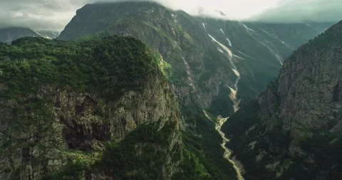 Aerial view of high cliffs and a mountain river in the gorge. Stock Footage 157731855