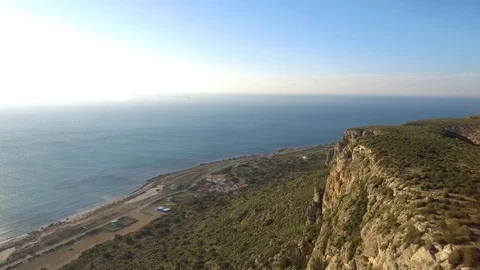 Aerial view from high cliffs overlooking Mediterranean Sea in 4K Stock Footage 74877664