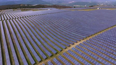 Aerial view of high-efficiency solar park under clear daylight skies Stock Footage 310689813