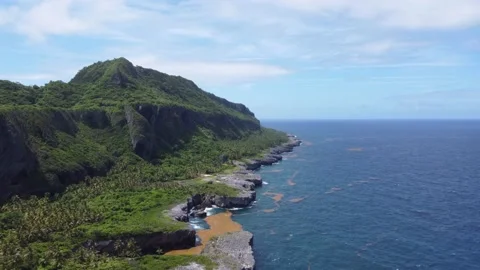 Aerial view of high green mountains and rocky coast of the Atlantic Ocean Stock Footage 156059853