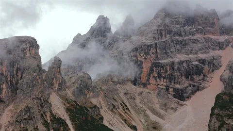 Aerial view of high mountain range with clouds in Dolomites, Italy Stock Footage 301542214