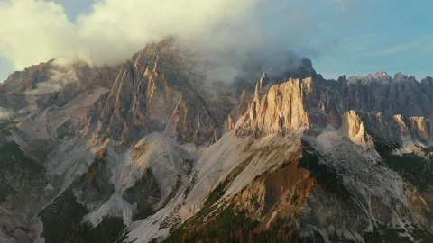 Aerial view of high mountain range with clouds in Dolomites, Italy Stock Footage 310268585