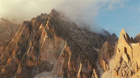 Aerial view of high mountain range with clouds in Dolomites, Italy Stock Footage 318724878