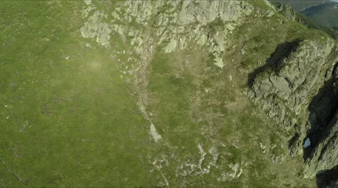 Aerial view of high mountain side, sunset light Vidéo 68417567