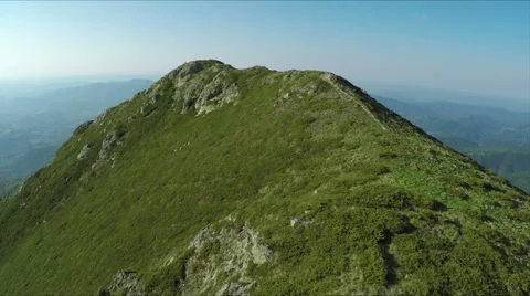 Aerial view of high mountain side, sunset light Stock Footage 68417945