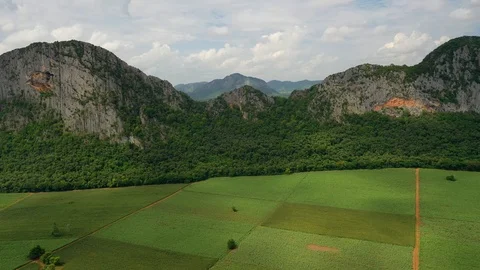 Aerial view. High mountain views and the verdant farmland of the countryside Stock Footage 112395201