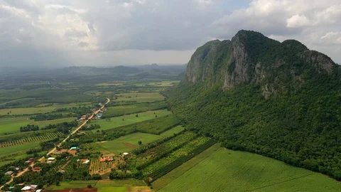 Aerial view. High mountain views and the verdant farmland of the countryside Stock Footage 112994928