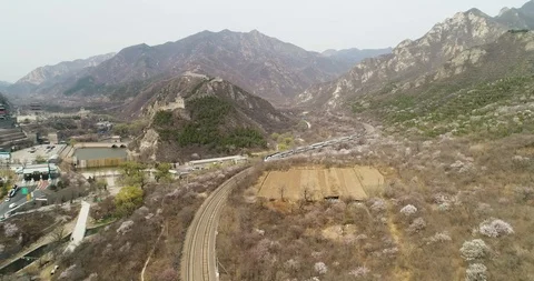 Aerial view of high speed bullet train and the Great Wall in China. Stock Footage 92397530