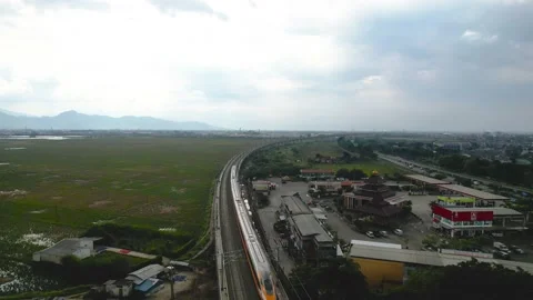 Aerial view of the High speed orange train on the railway station. Stock Footage 232123200
