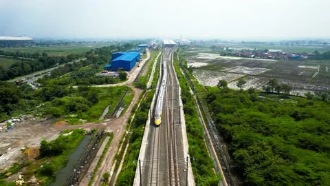 Aerial view of the High speed orange train on the railway station. Stock Footage 232124235