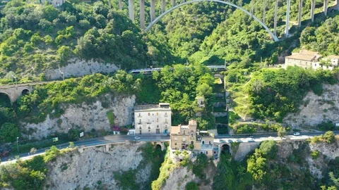 Aerial view of high-speed train in the mountain railway Stock Footage 111838894