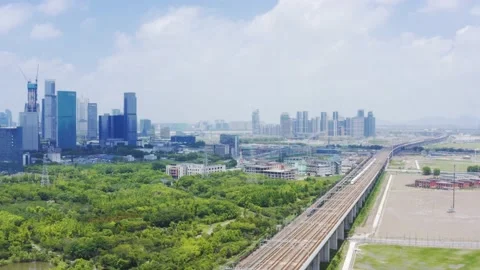 Aerial view of high speed train running through hangzhou qianjiang century new Stock Footage 194620497