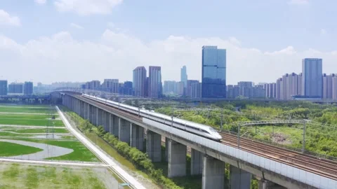 Aerial view of high speed train running through hangzhou qianjiang century new Stock Footage 194620809