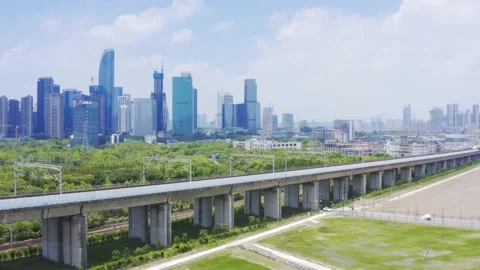 Aerial view of high speed train running through hangzhou qianjiang century new Stock Footage 194620821