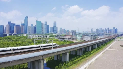 Aerial view of high speed train running through hangzhou qianjiang century new Stock Footage 194621937