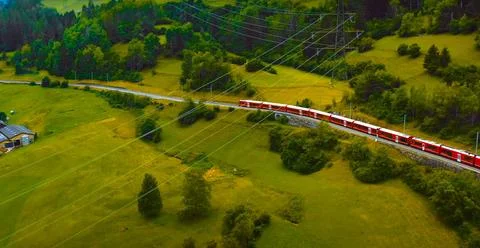 Aerial view of a high speed train passing through the countryside. Stock Photos